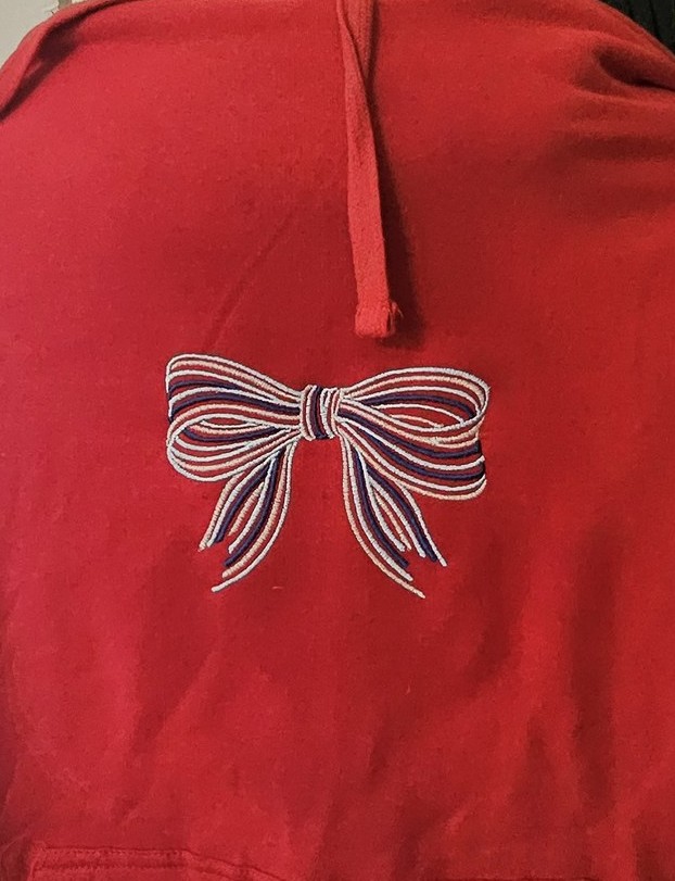 Red hoodie with embroidered bow detail