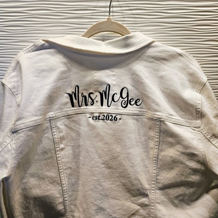 White bridal jacket personalized with embroidery