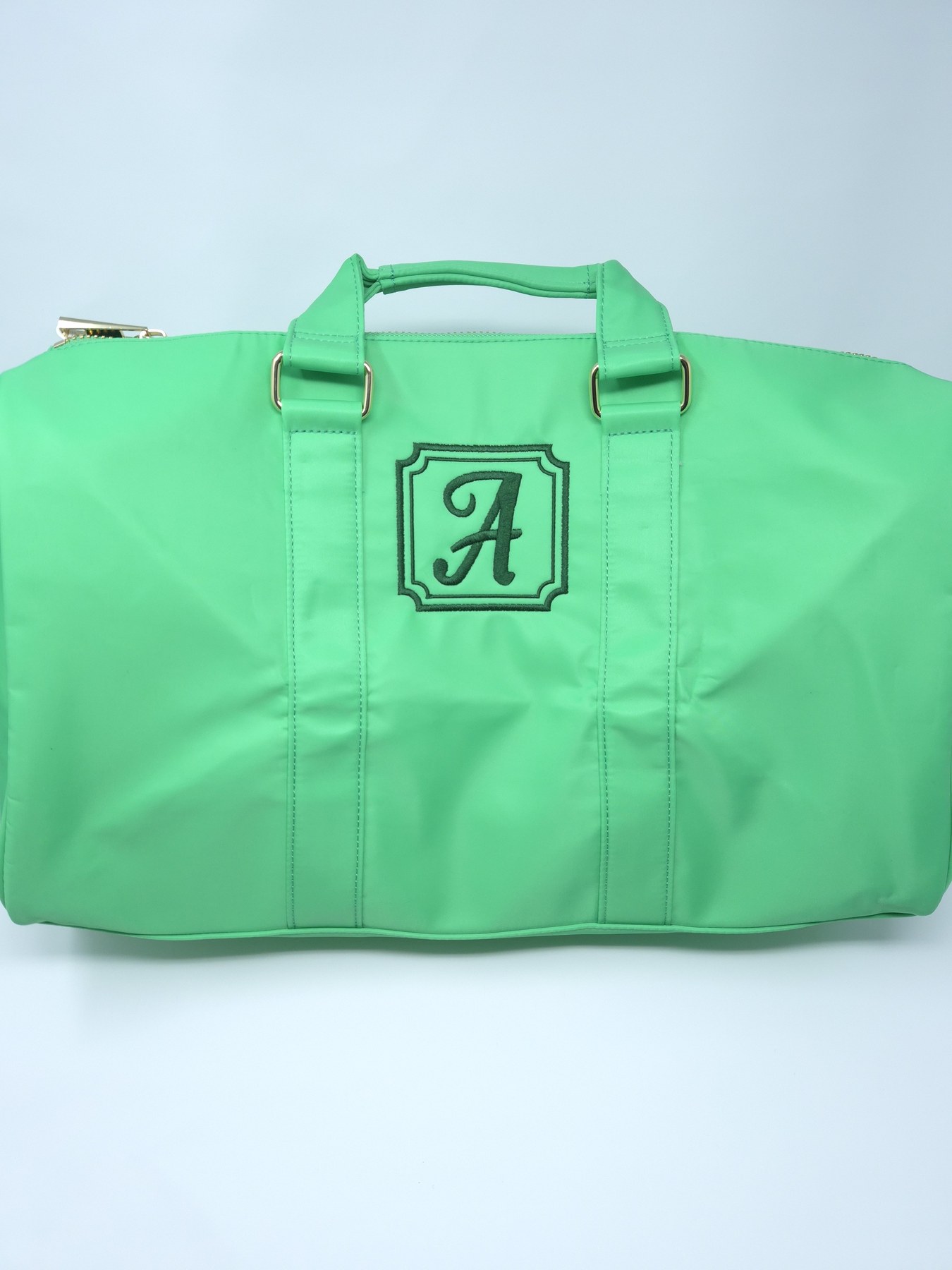 Mint duffel bag with framed monogram