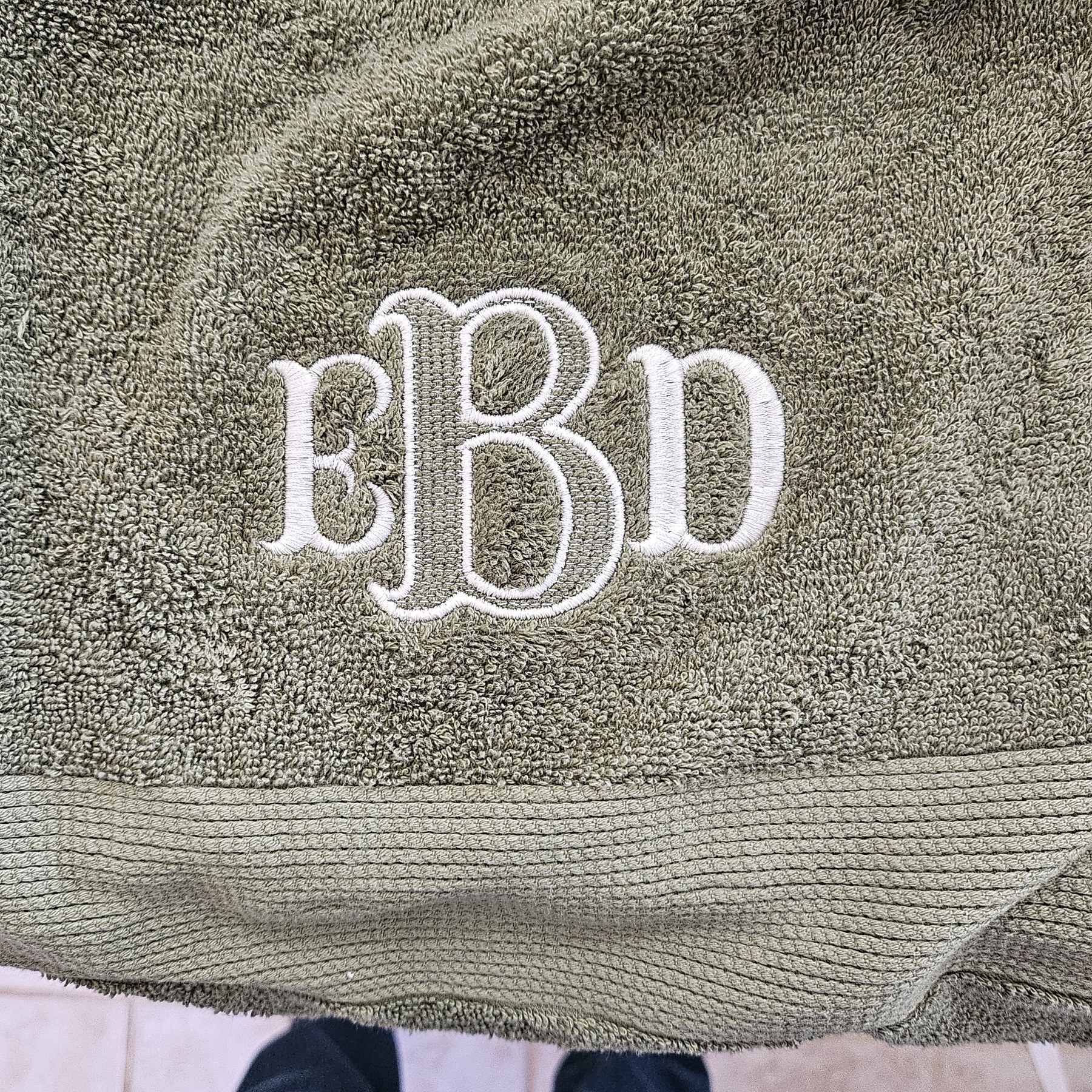 Monogrammed towel with elegant white stitching
